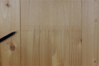 FIG 5.9 Vertical splits to outer lamella of vertical wall panel (beside finger joint in surface board).