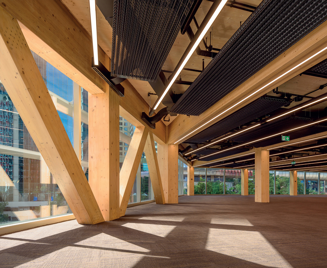 FIG 8.0 (chapter opener) Expressed services coordinated with a timber hybrid glulam structure on a CLT soffit for International House, a trend-setting commercial office precedent in Sydney (by Tzannes Associates, 2017).