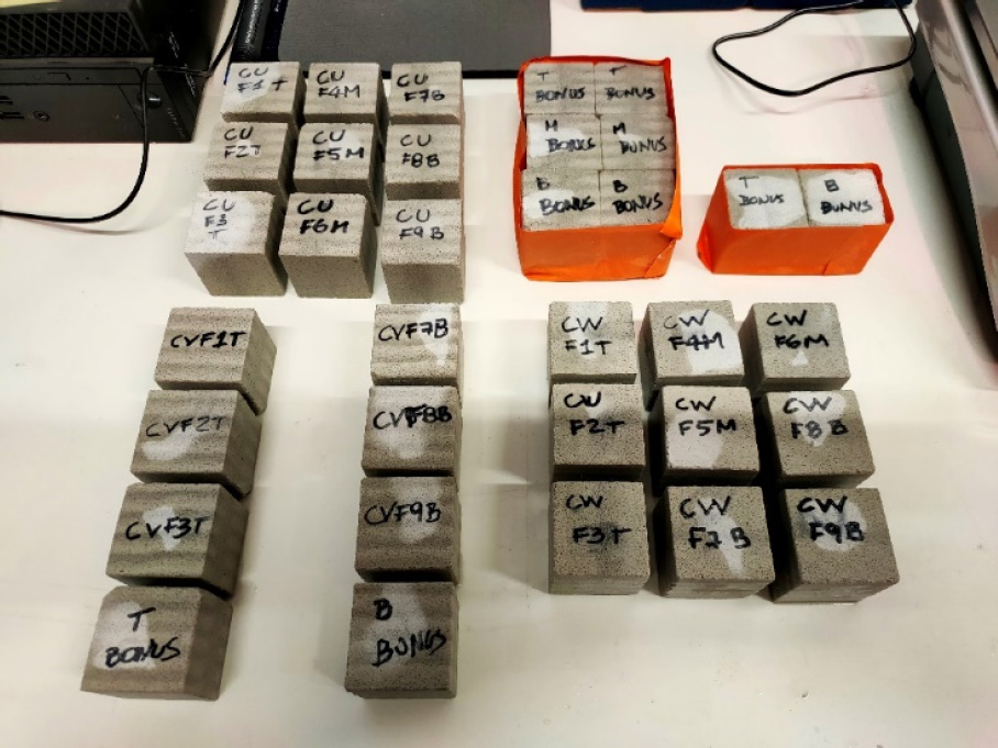 An image features a group of calculators with visible keys and displays. A collection of text entries and labels accompanies them, indicating their usage or models. The setting appears to be indoors, showcasing electronic devices in a typical working environment.