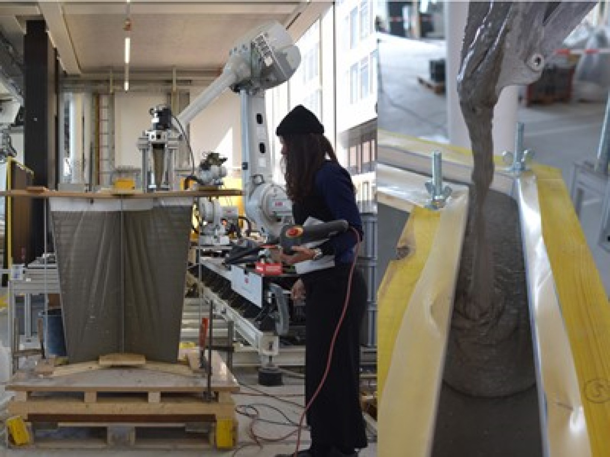 A photograph depicts a person engaged in work within a factory setting. The focus is on robotic concrete casting, specifically involving the use of PE film under tension. The image captures a modern industrial process and emphasizes the combination of technology and manual labour in manufacturing.